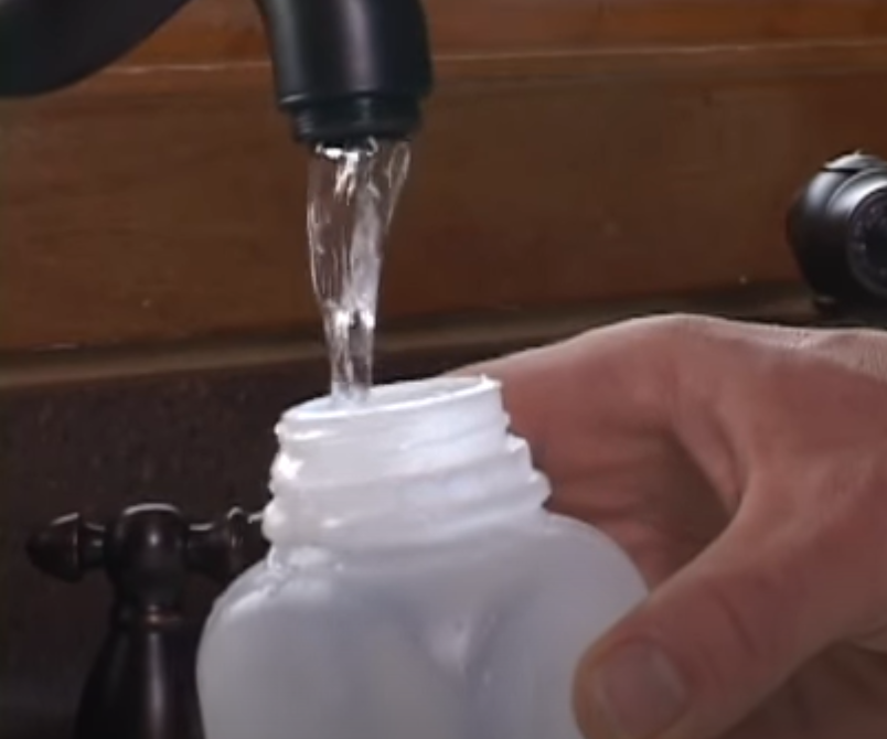 Photo of collecting a kitchen sink bacteria sample.